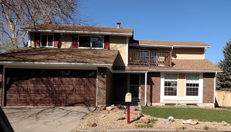 Front of house before siding replacement